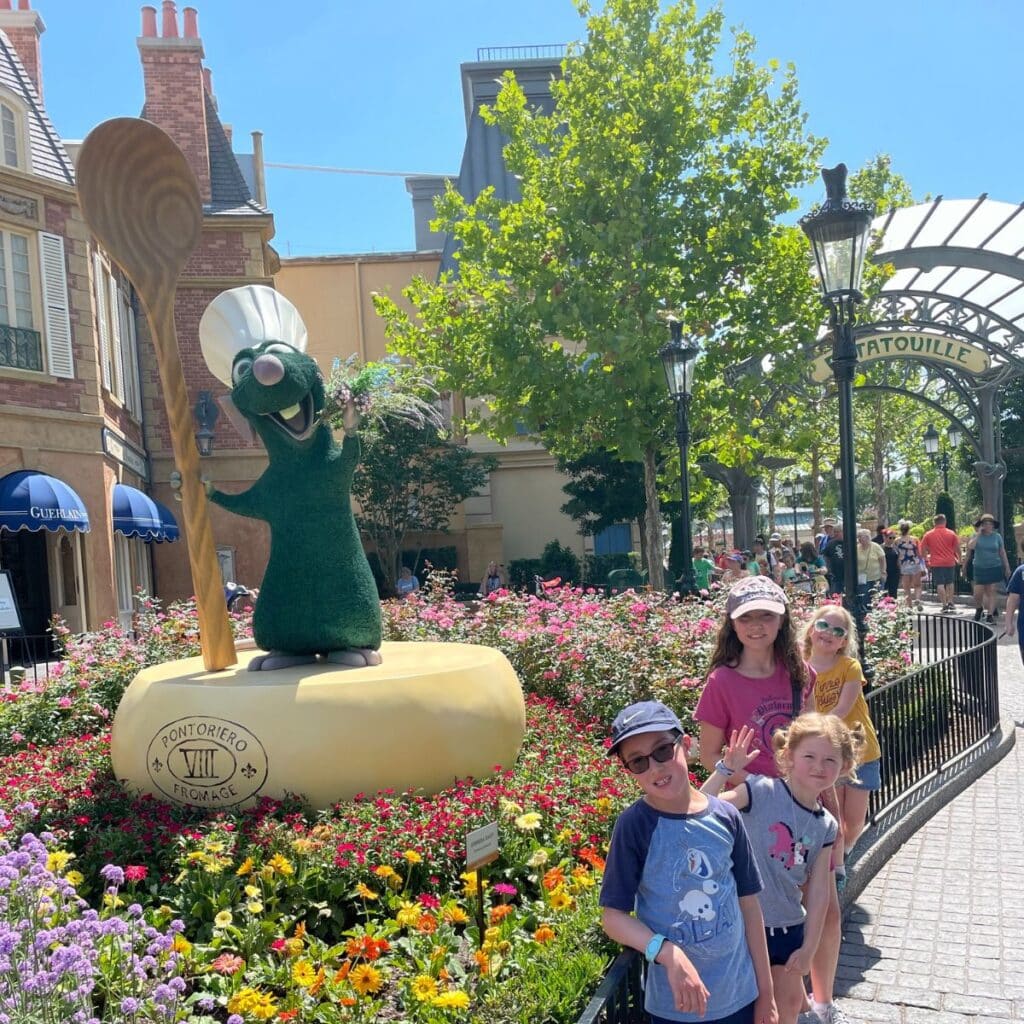 children posing outside ratatouille ride disney world