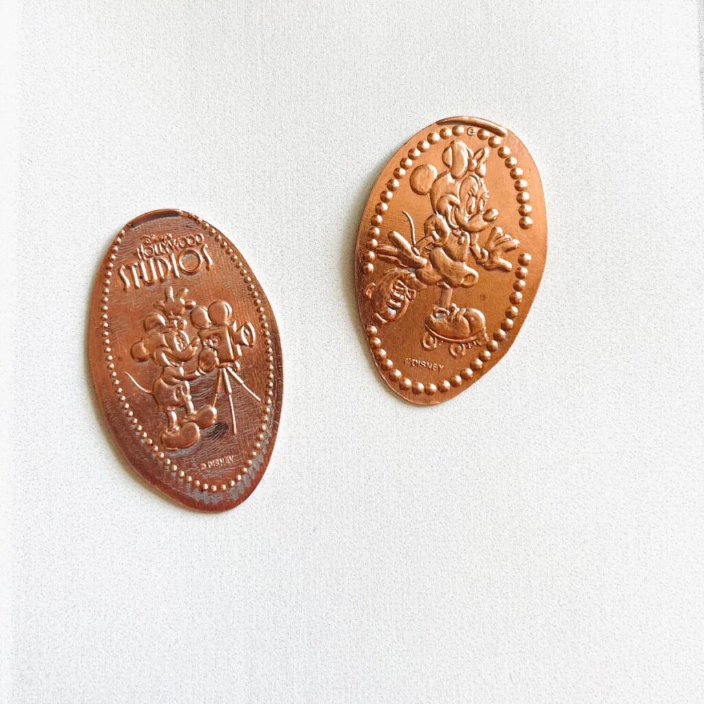 pressed penny coin with minnie and mickey on it