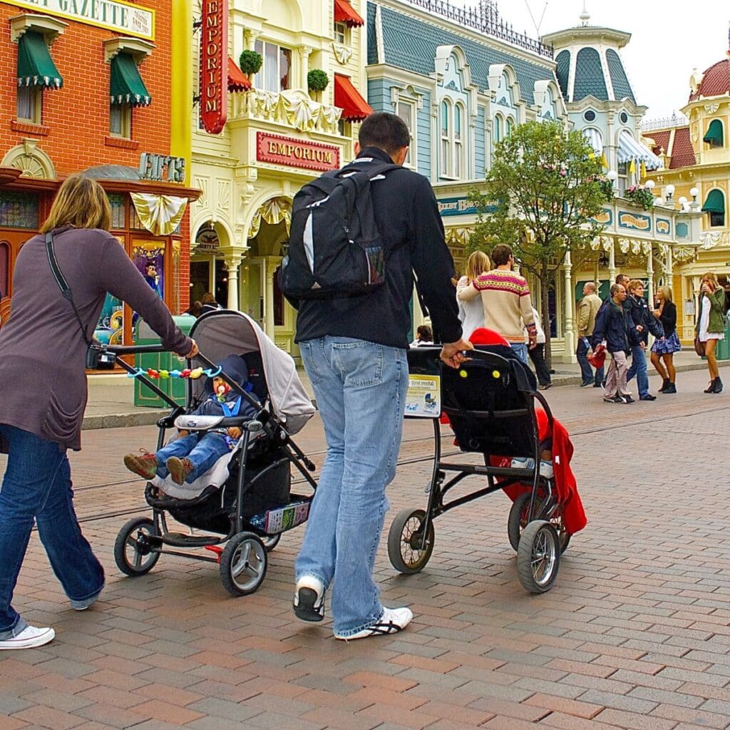 how to mark a stroller at Disney - parents pushing children down Main Street.
