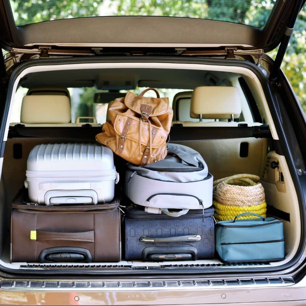trunk of car packed with suitcases