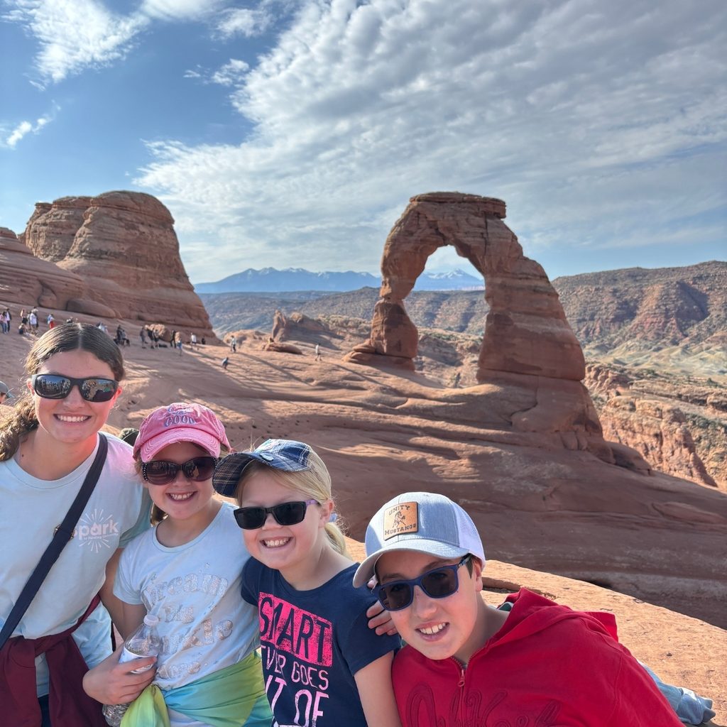 kids at Delicate Arch on Arches National Park